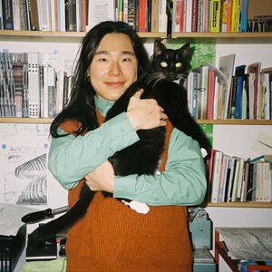 Noam Youngrak Son with their feline cohabiter Sirius